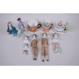 A collection of antique continental porcelain doll heads and appendages, together with three