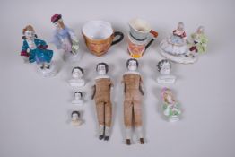 A collection of antique continental porcelain doll heads and appendages, together with three