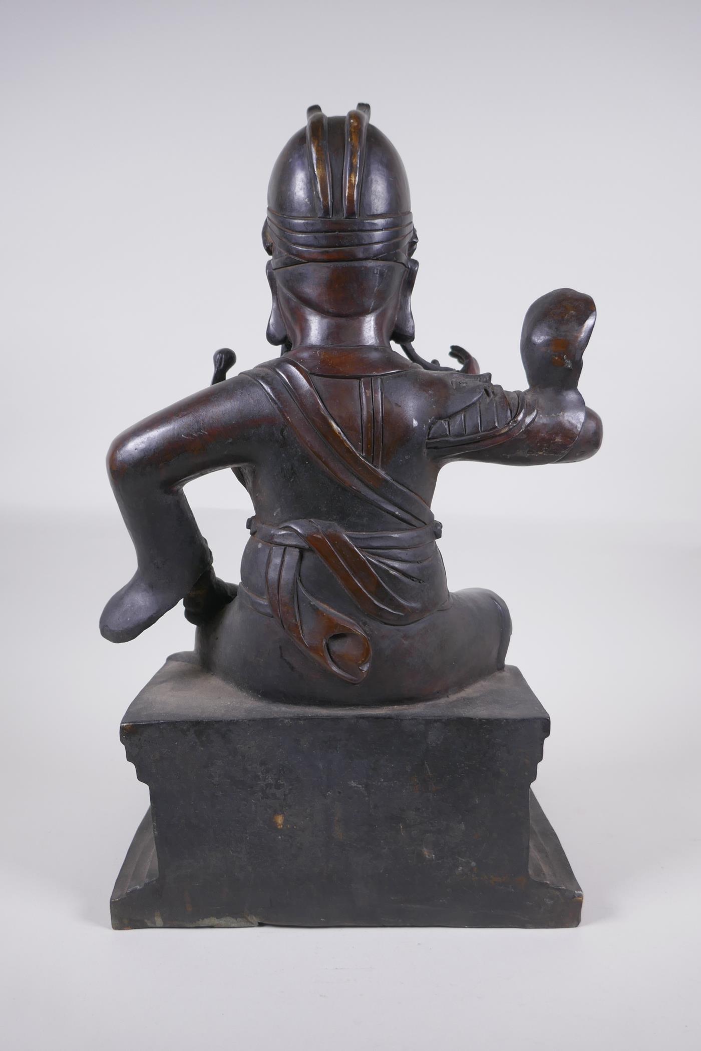 A large Chinese bronze figure of an immortal warrior seated on a throne, 45cm high - Image 4 of 5