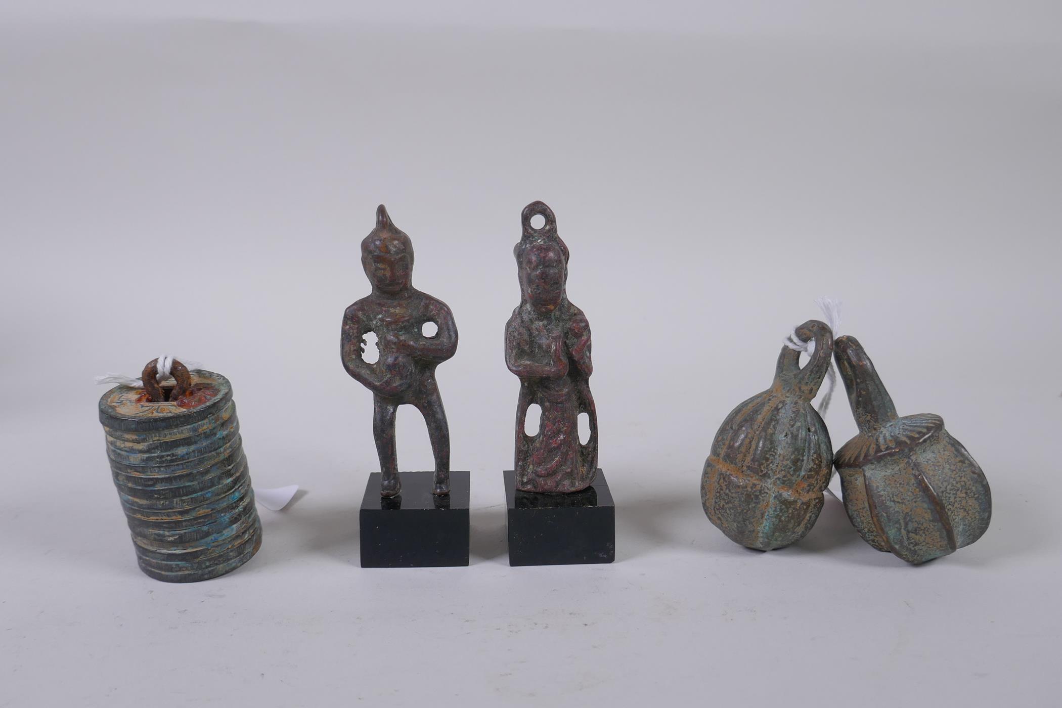 Two Chinese archaic style bronze figures, a pair of bronze scroll weight in the form of gourds and