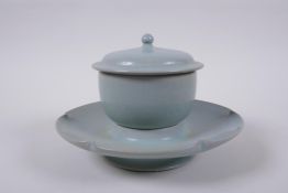 A Chinese Ru ware style tea set comprising a tea bowl, cover and petal shaped saucer, 18cm diameter