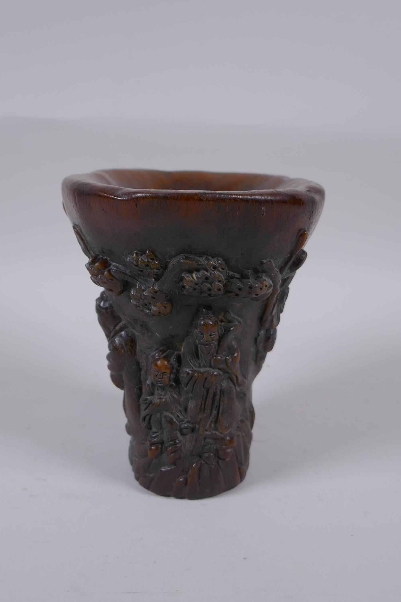 A Chinese faux horn libation cup with carved figural decoration, seal mark to base, 14cm high - Image 2 of 5