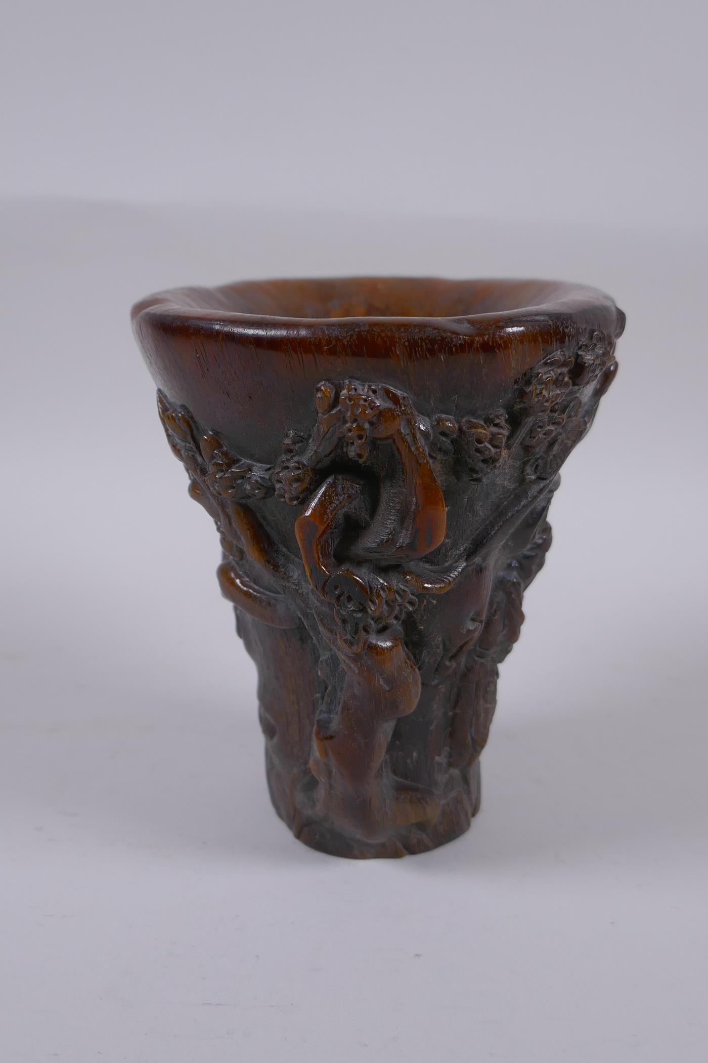 A Chinese faux horn libation cup with carved figural decoration, seal mark to base, 14cm high - Image 4 of 5