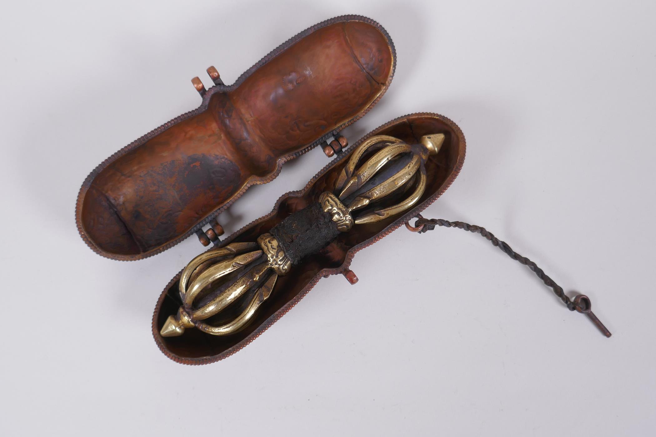 A Tibetan bronze vajra in a repousse copper carry case, 18cm long - Image 4 of 4