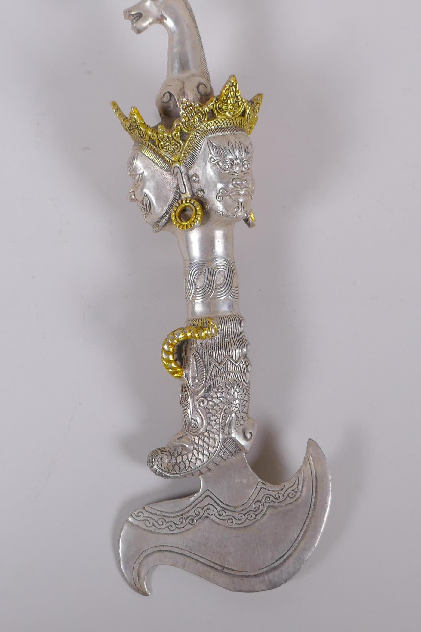 A Tibetan white metal kartika, the handle decorated with wrathful deity masks, 27cm - Image 4 of 5