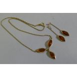 A 9ct gold amber set necklace and matching drop earrings, gross weight 7g