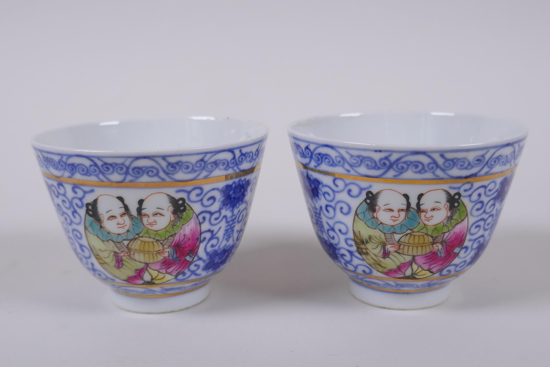 A pair of Chinese blue and white porcelain tea bowls with polychrome enamels panels depicting two - Image 3 of 5