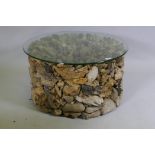 A driftwood glass topped coffee table, 74cm diameter, 40cm high