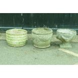 Three reconstituted stone garden planters, largest 32cm high