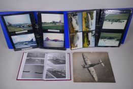 A black and white photograph of a spitfire and three albums of photos of military aircraft