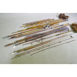 A quantity of vintage cane and fibreglass fishing rods