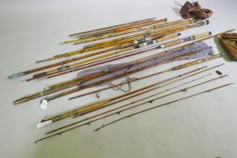 A quantity of vintage cane and fibreglass fishing rods