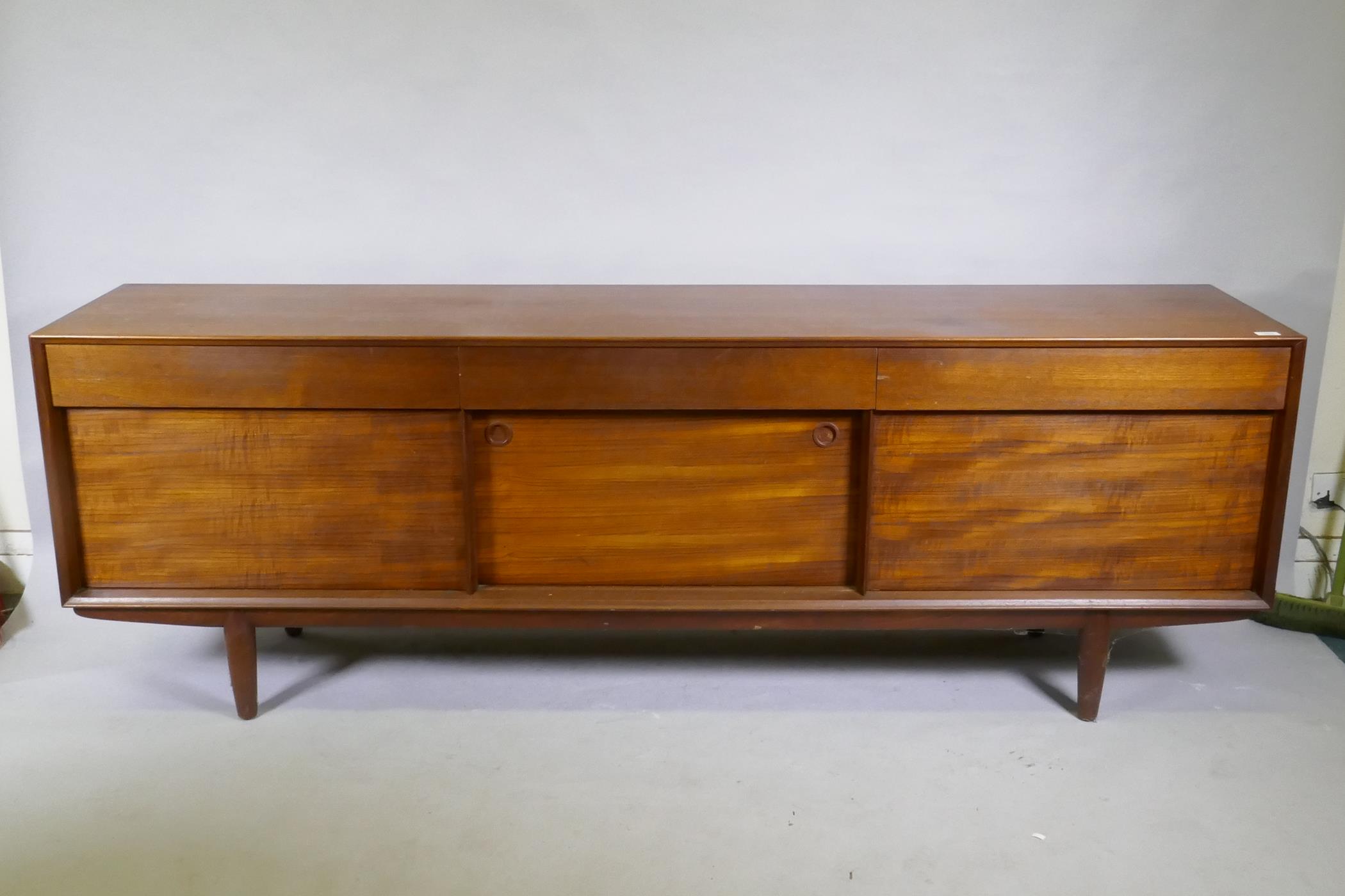 A mid century teak sideboard designed by John Herbert for A. Younger, 213 x 46cm, 72cm high