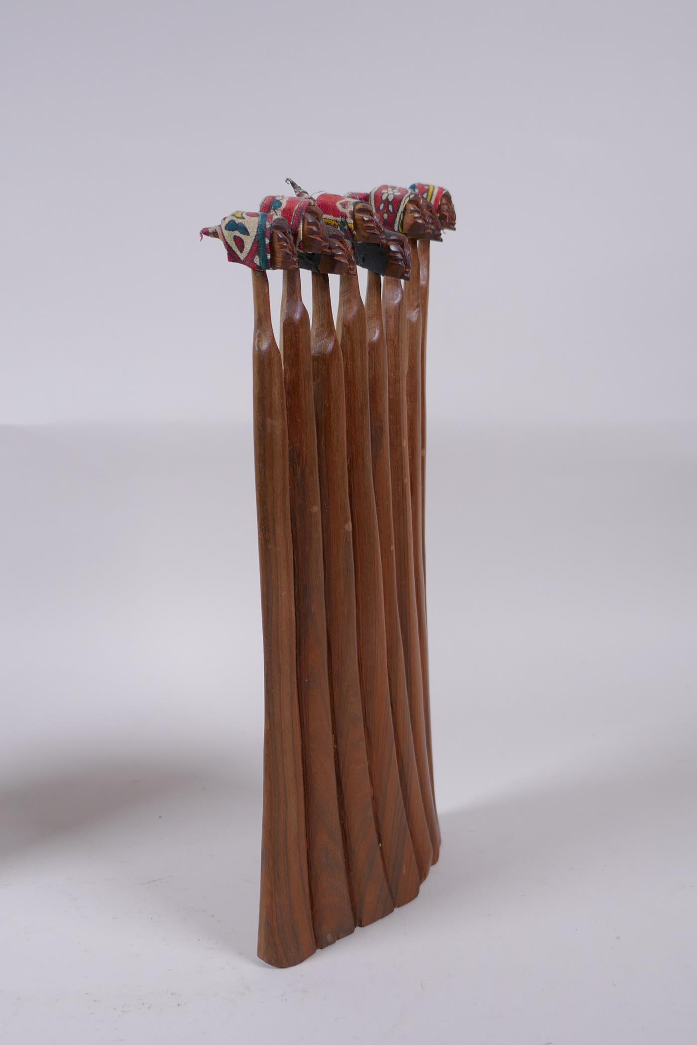 Two African carved hardwood female figure groups with traditional material headdresses, and an - Image 5 of 7