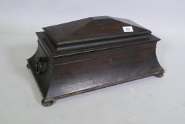 A large Regency rosewood sarcophagus shaped tea caddy, the two divisions with lift up tops and