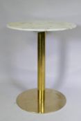 A marble top occasional table raised on a brass column and platform base, 60cm diameter, 75cm high