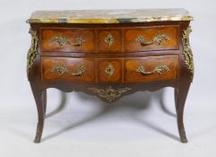 A C19th French tulipwood two drawer bombe shaped commode with ormolu mounts and yellow breccia