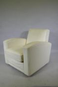 A contemporary club style armchair with leatherette cover