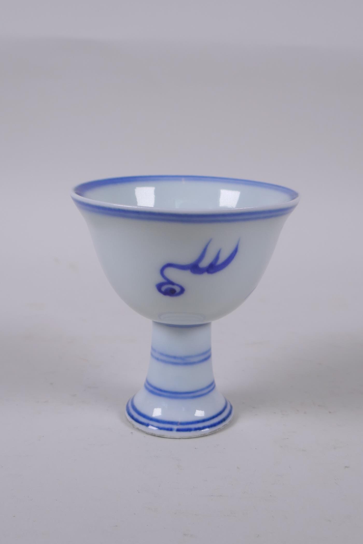 A Chinese blue and white stem cup decorated with a dragon chasing the flaming pearl, Xuande 6 - Image 3 of 4