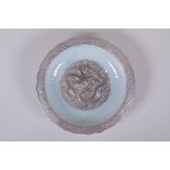 A celadon and silver ground dish with lobed rim and raised dragon decoration, Chinese Qianlong