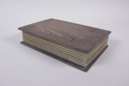 A Chinese wood and silk bound book containing white jade tablets with chased and gilt character
