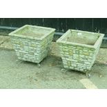 A pair of concrete garden planters, 38cm high