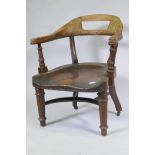 A C19th mahogany bow back desk chair with one piece saddle shaped seat and crinoline stretcher,