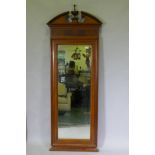 A C19th Continental mahogany pier glass, with broken pediment top, moulded frame and original mirror