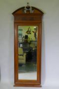 A C19th Continental mahogany pier glass, with broken pediment top, moulded frame and original mirror