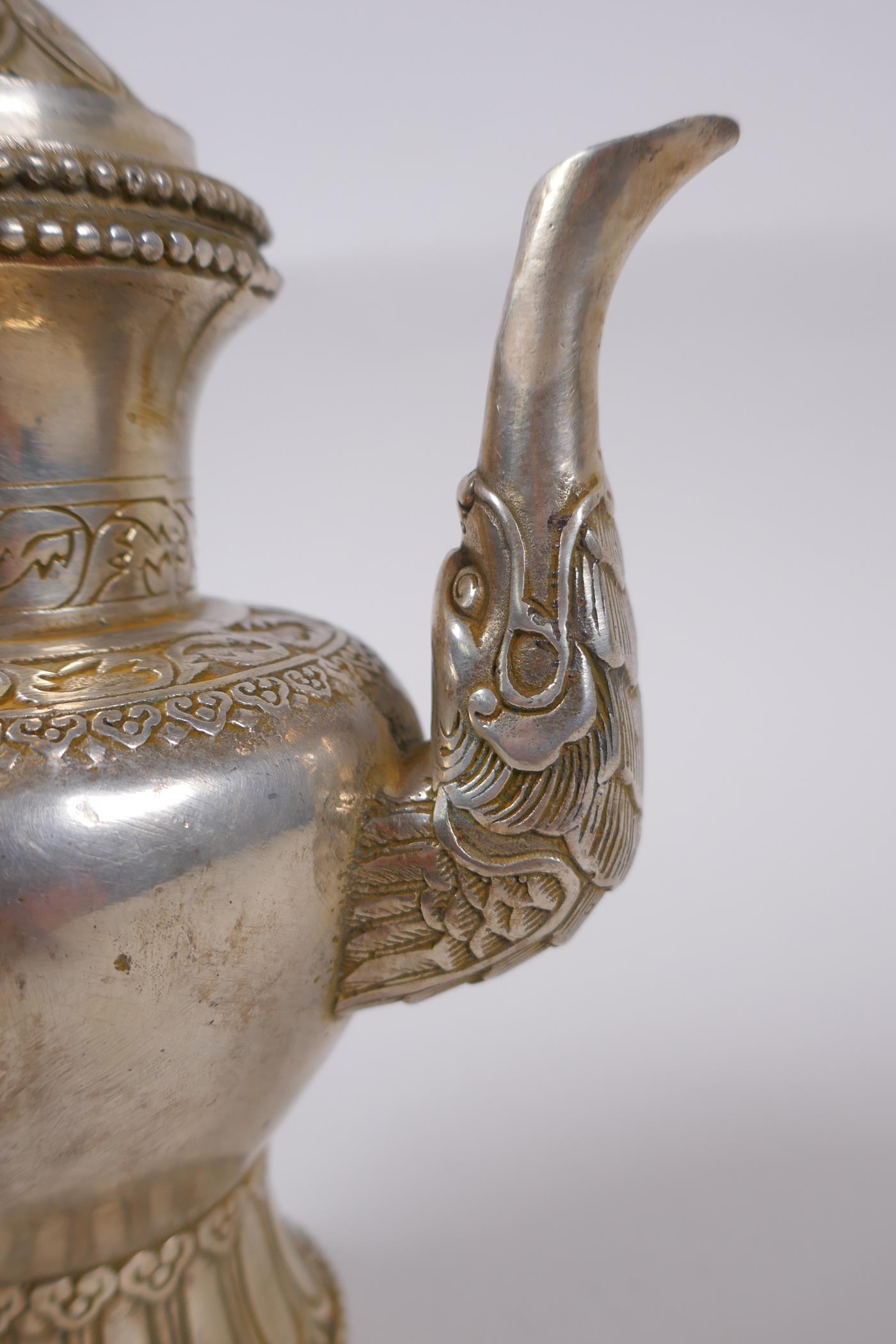 A Tibetan white metal ewer, double vajra mark to base, 20cm high - Image 3 of 6