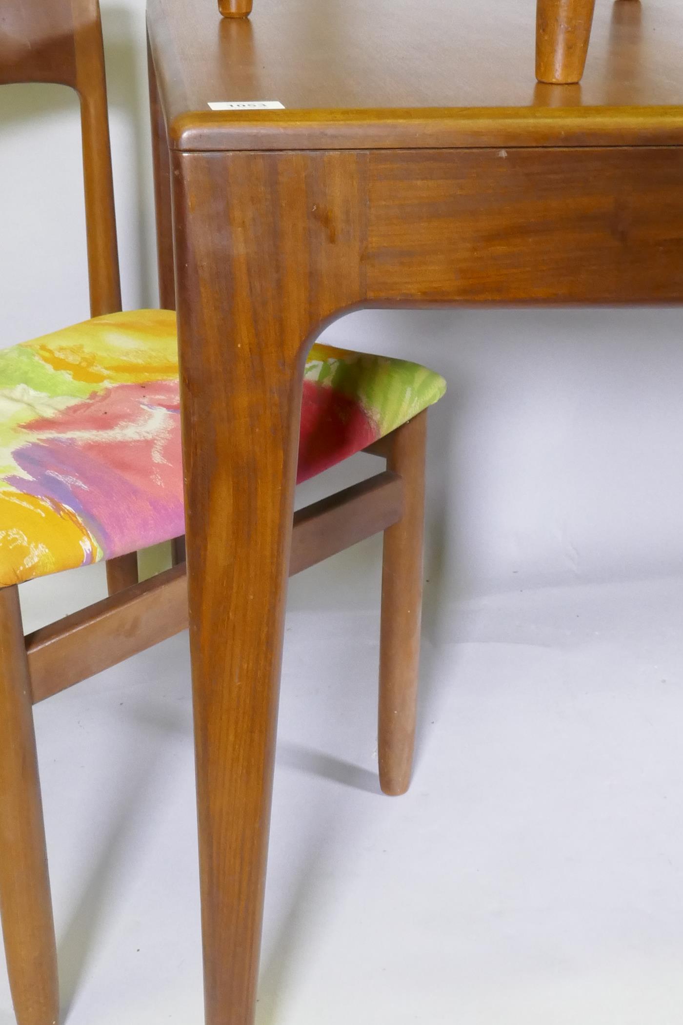 A mid century teak extending dining table, with folding leaf, designed by John Herbert for A. - Image 4 of 5