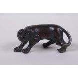 A Japanese carved boxwood tiger netsuke, 5cm long