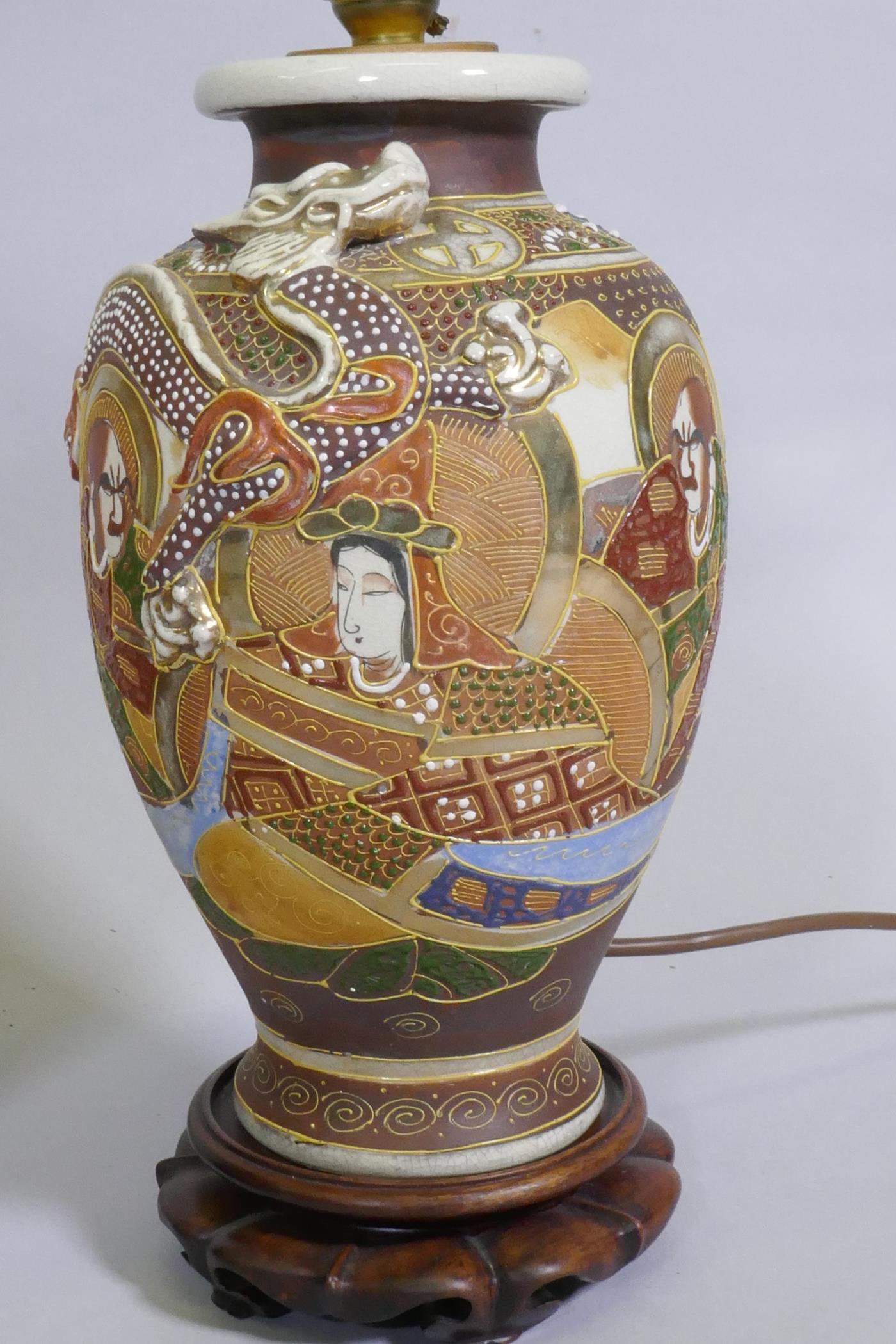 A pair of oriental ceramic table lamps mounted on carved wood bases, 34cm high - Image 2 of 4