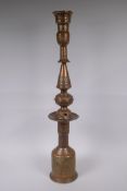 A middle eastern copper and brass hookah pipe with repousse floral decoration, 72cm high