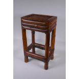 An Oriental bamboo occasional table, 30 x 23cm, 53cm high