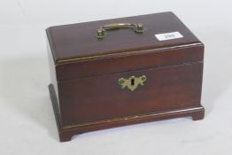 A Georgian mahogany tea caddy, with brass handle and escutcheon, lacks interior, 22 x 13 x 14cm