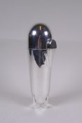 A silver plated cocktail shaker in the form of a Zeppelin, opening to reveal mixologist tools,