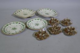 A set of five Meiji eggshell porcelain tea cups and saucers with five butterfly decoration with gilt