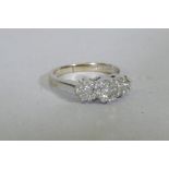 A 14ct white gold diamond cluster ring, 19 diamonds, 3.4g