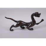 A Chinese stylised bronze figure of a dragon, 32cm long