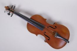 An antique half size violin with a two piece back and ebony finger board, 46cm long