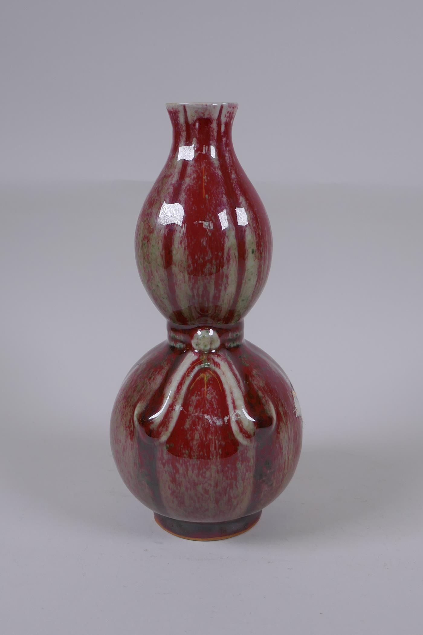 A Chinese flambe glazed double gourd porcelain vase, 25cm high