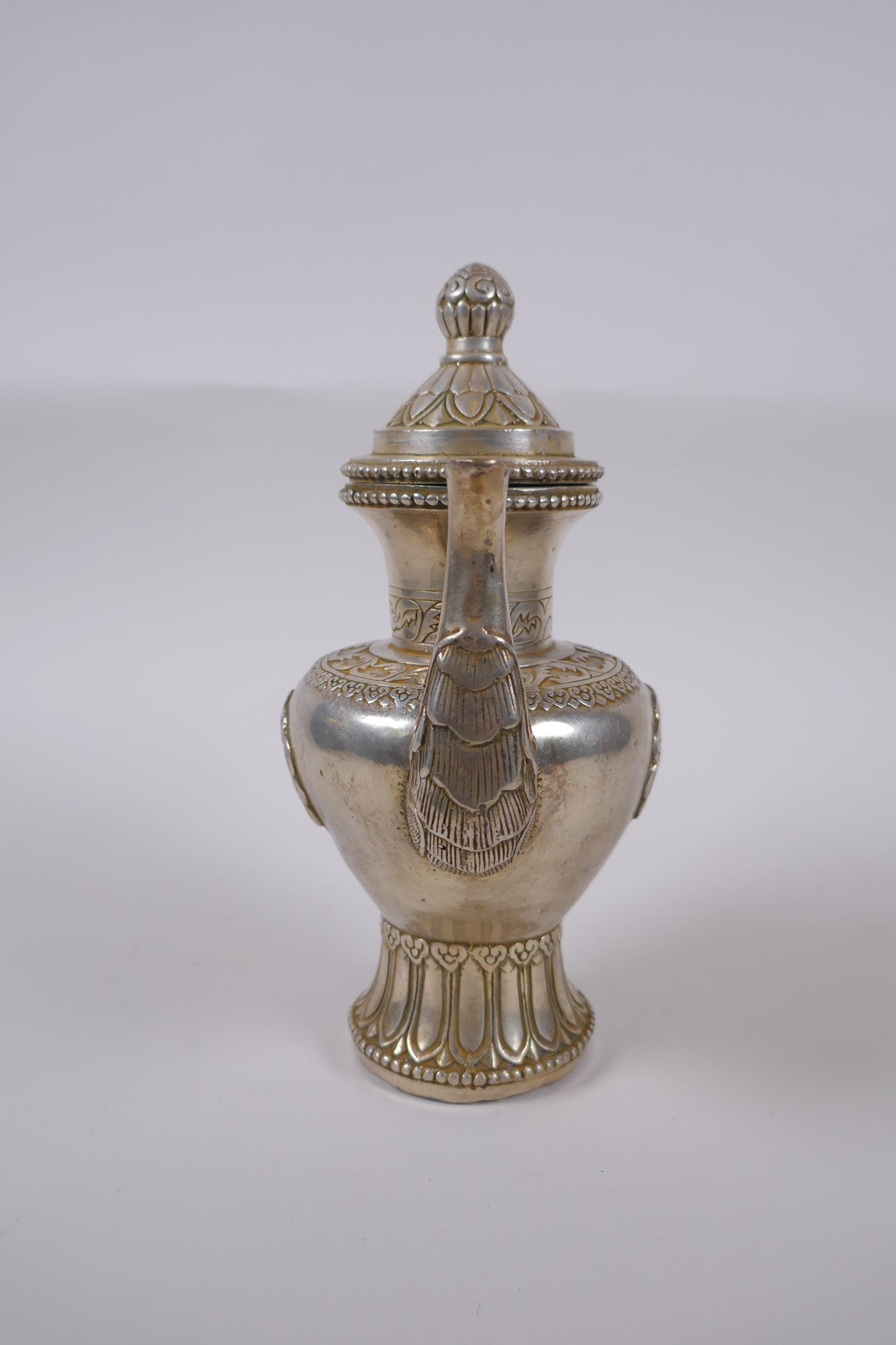 A Tibetan white metal ewer, double vajra mark to base, 20cm high - Image 4 of 6