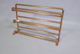 A rack fabricated from copper pipe, 55 x 14 x 36cm