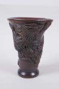 A Chinese faux horn libation cup with phoenix decoration, seal mark to base, 13.5cm high