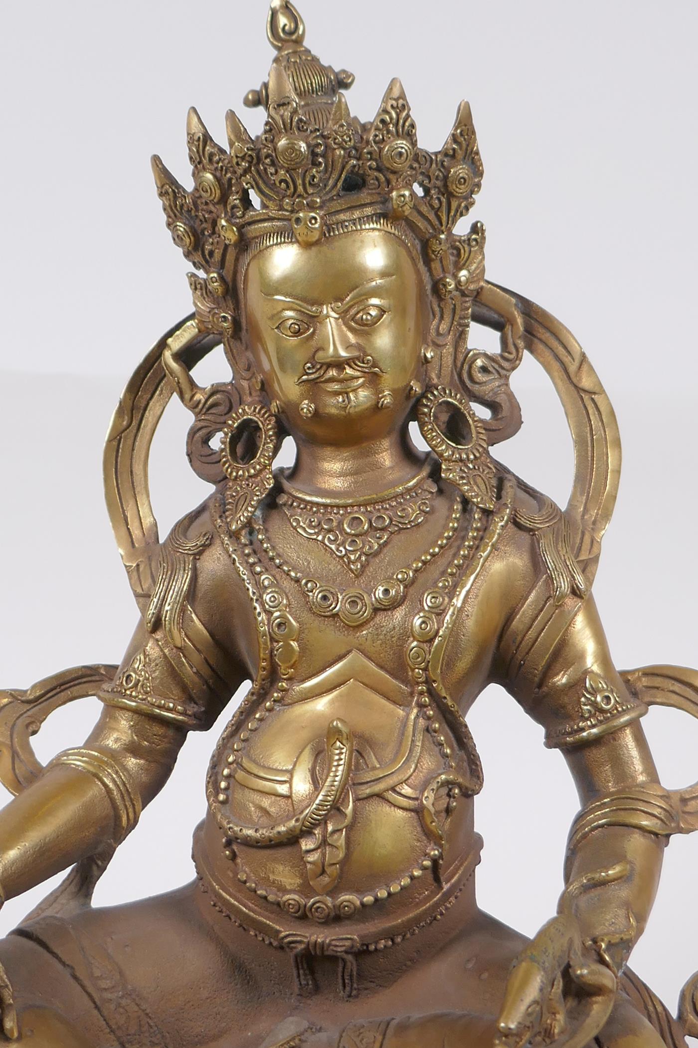 A Tibetan bronze figure of a wrathful deity, impressed double vajra mark to base, 29cm high - Image 2 of 7