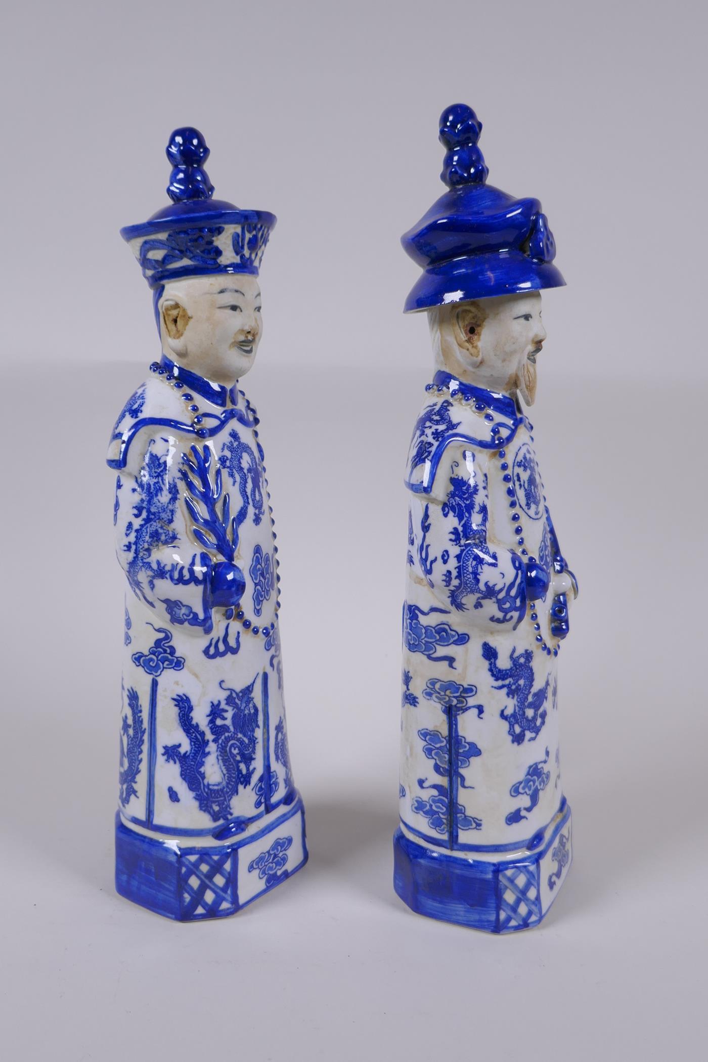 A pair of Chinese Qing Dynasty blue and white porcelain figures, impressed marks to base, 29cm high - Image 2 of 6