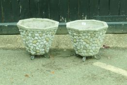 A pair of concrete garden planters, 34cm high