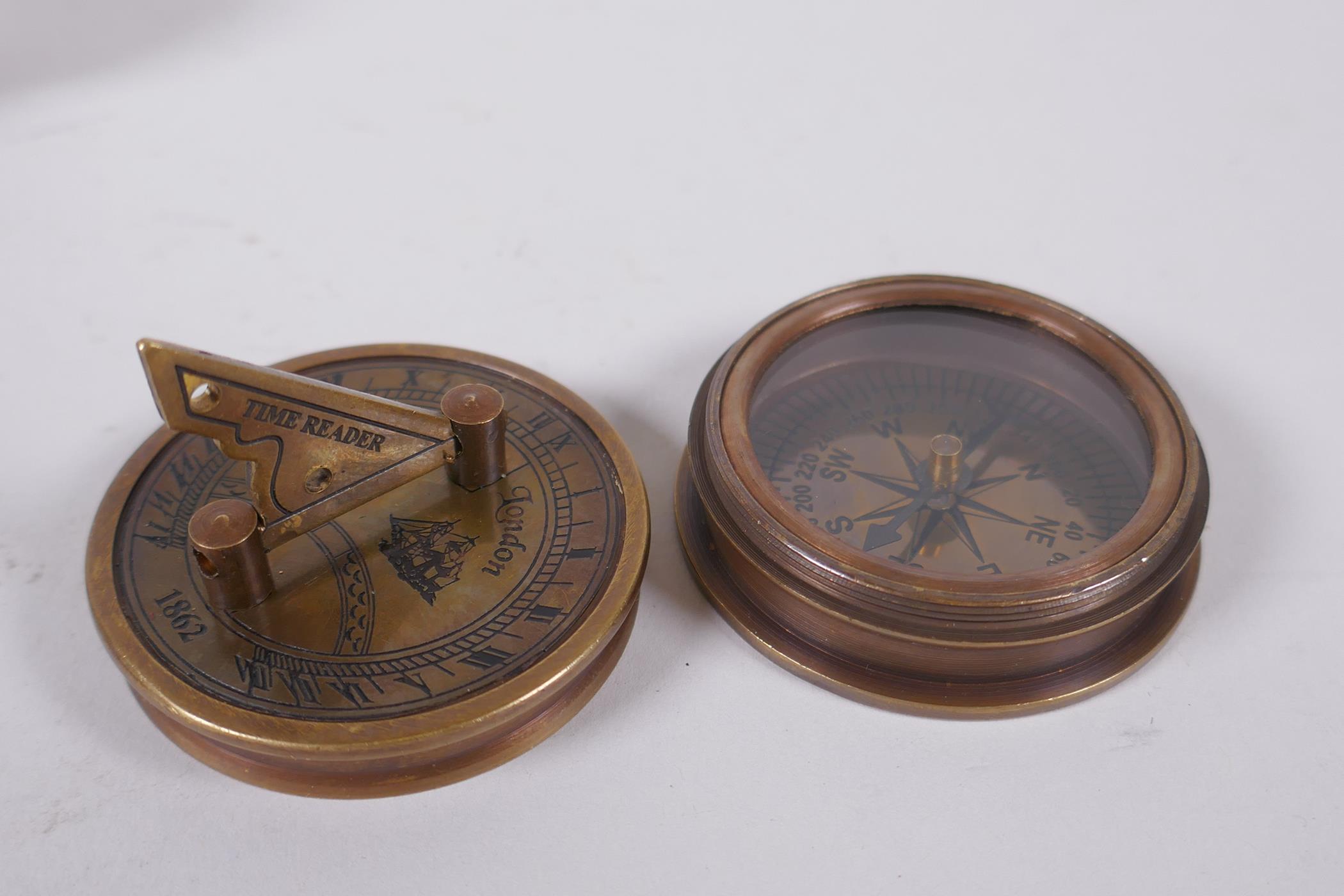 A reproduction brass sundial compass and a brass and leatherette miniature telescope, 13cm long - Image 2 of 3