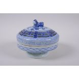 A Chinese blue and white porcelain cylinder censer and cover with raised foot and kylin knop, 16cm